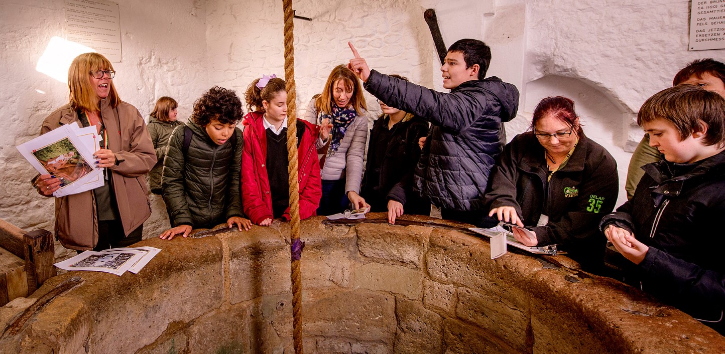 An education visits officer instructing some school children