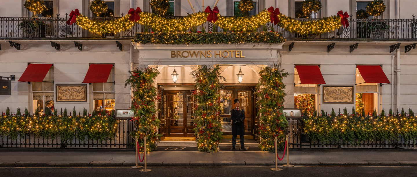 The entrance to Brown's Hotel decorated with Christmas lights and decorations. 