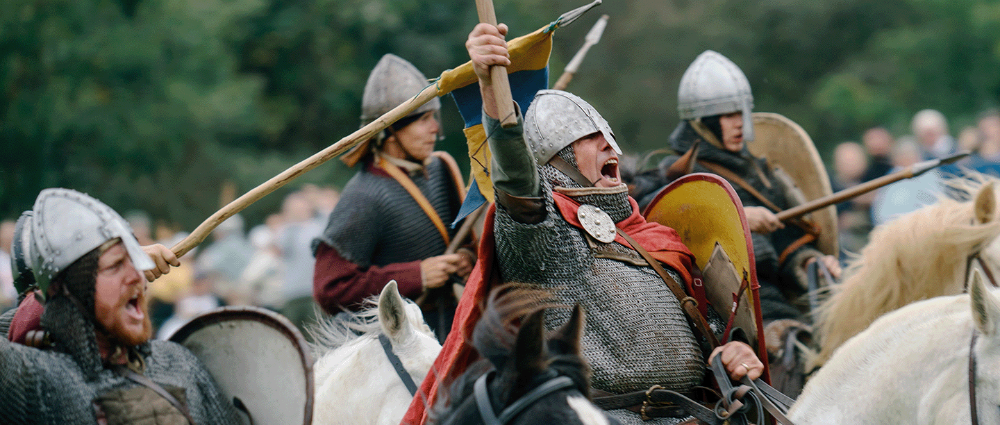 Photo of historical interpreters dressed as soldiers at a re-enactment of the Battle of Hastings