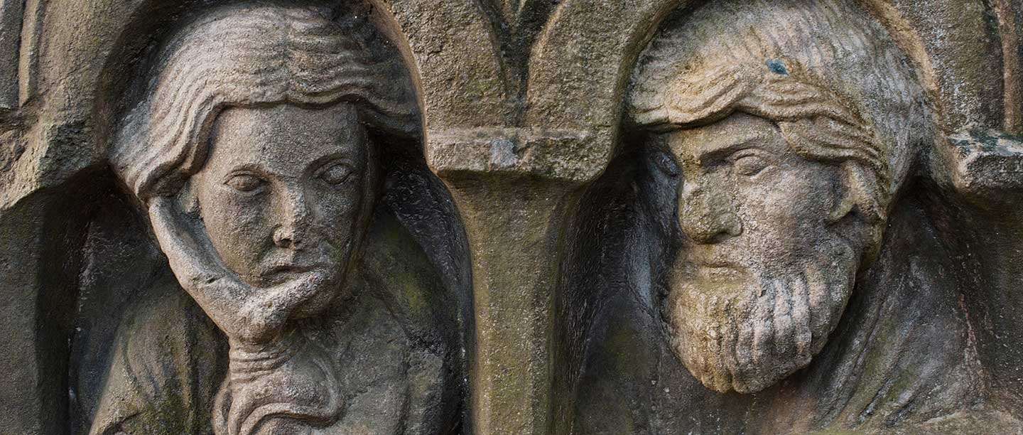 Stone carving of two faces
