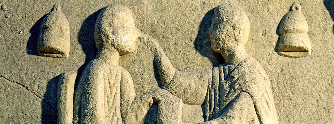 Carving of an oculist examining a patient Carving of an oculist examining a patient