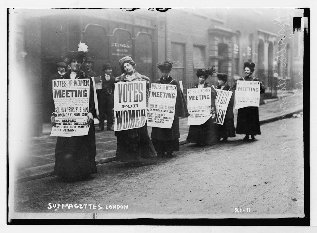 Suffragettes holding up Votes for Women banners, London 