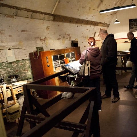 Photo of visitors exploring the Second World War tunnels at Dover Castle