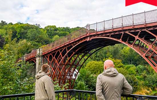 Image: two people looking at Iron Bridge