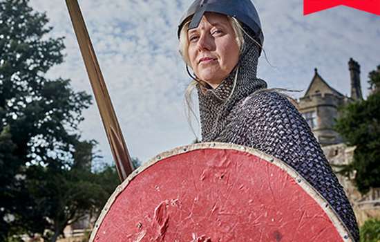Image: woman dressed as a Battle of Hastings soldier