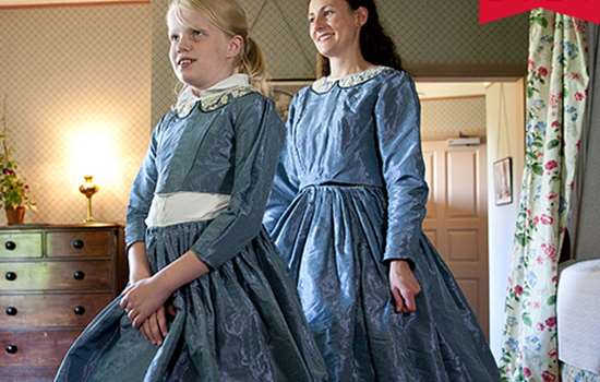 Image: visitors try on Victorian clothes at Down House