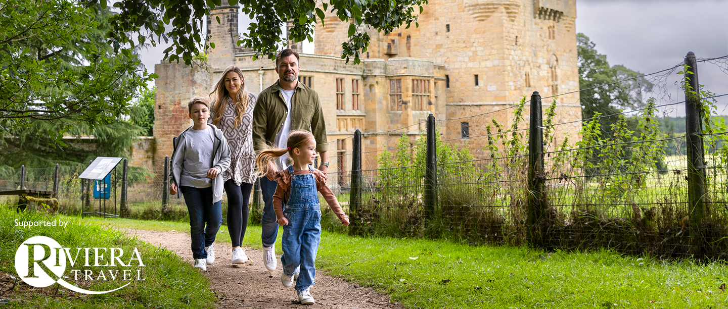Image: a family explores with Belsay castle behind