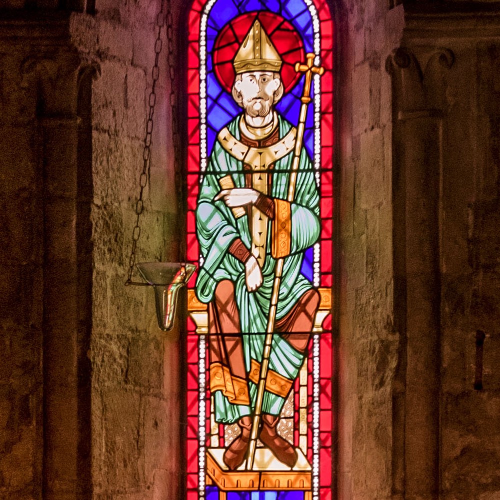 Photo of a colourful stained-glass window at Dover Castle featuring Thomas Becket