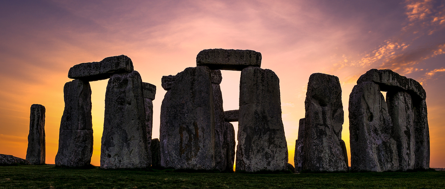 Image: sun setting behind Stonehenge