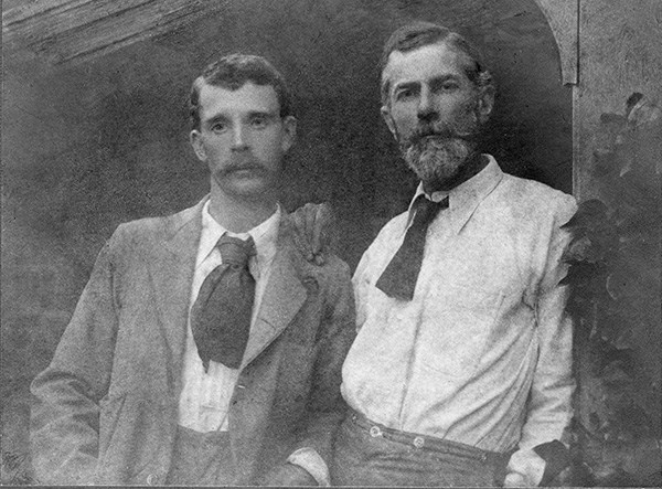 Black and white photograph of George Merrill and Edward Carpenter with Carpenter's hand resting on Merrill's shoulder