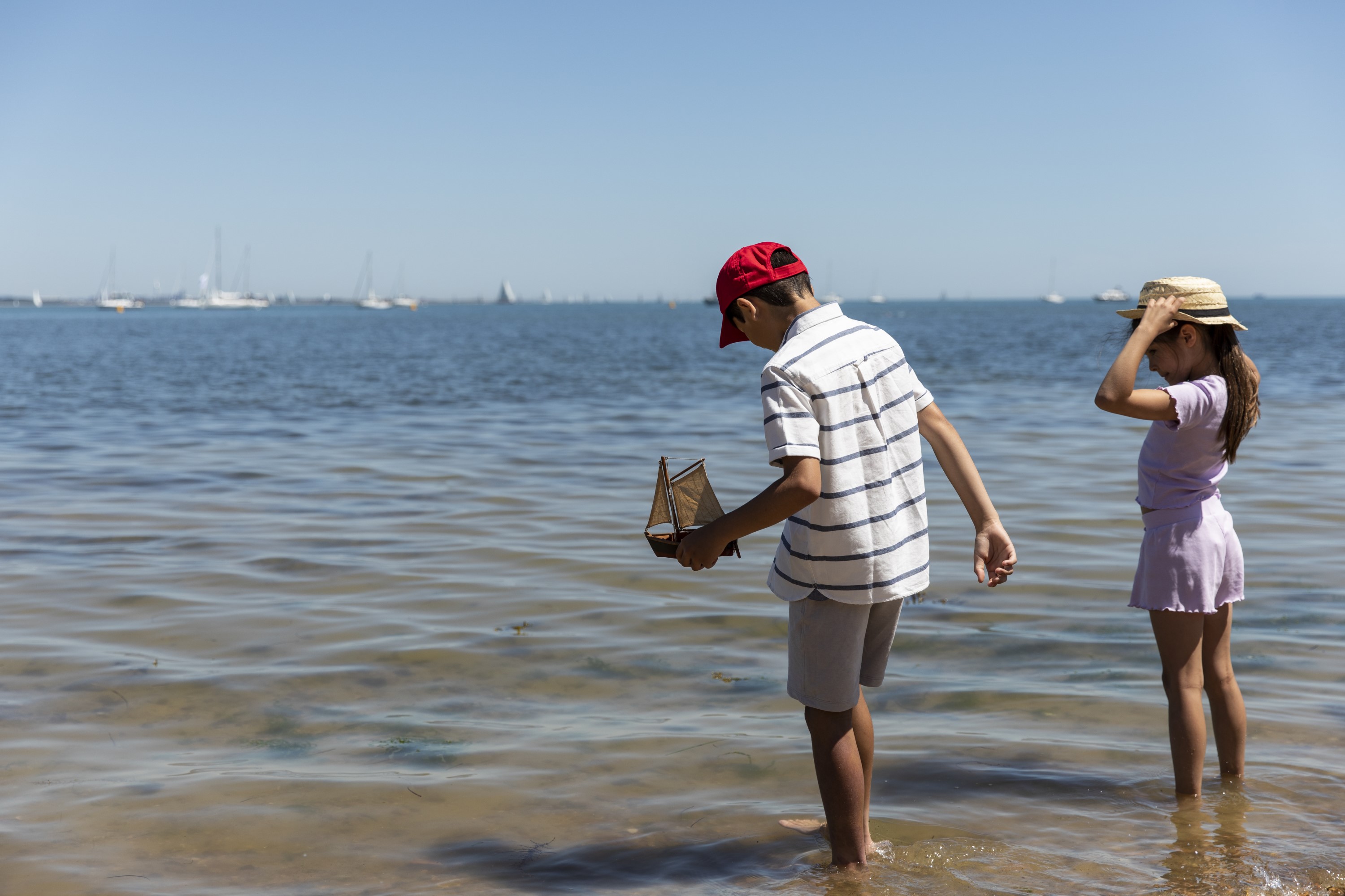 Image: Children paddling in the sea at Osborne