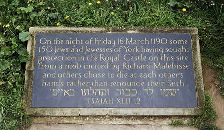 Commemorative plaque at the base of the mound of Clifford's Tower today Commemorative plaque at the base of the mound of Clifford's Tower today