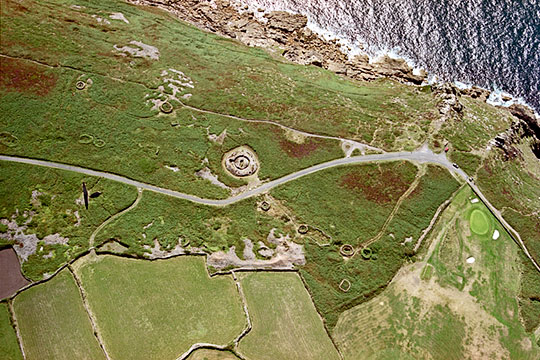 Aerial view of the Bronze Age tomb at Ballowall Barrow, Cornwall, located close to the cliff edge