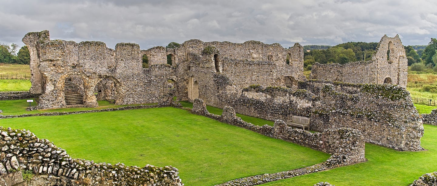 A view of the stone remains and walls of Castle Acre Priory.