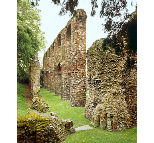 Norman arches along the north aisle rise from a green lawn