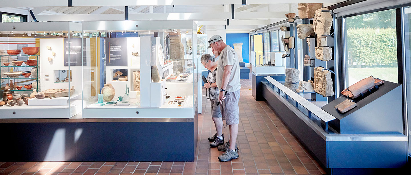 Visitors examine items in the museum at Corbridge Roman Town