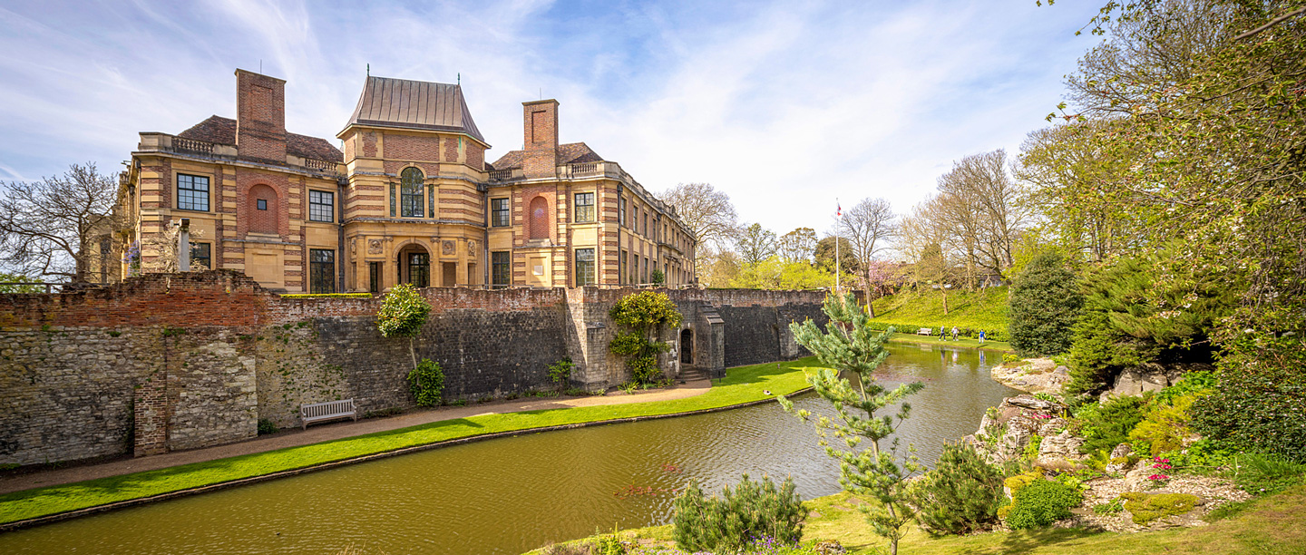 A view of Eltham Palace from across the moat and bridge.