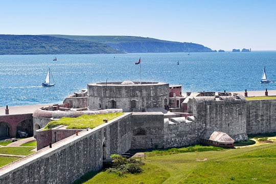 Hurst Castle today, looking south-west towards the Needles Passage and the Isle of Wight, on a clear sunny day with yachts at sea