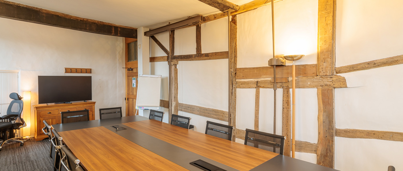 A view of a meeting room with timber-framed beams at Kenilworth Castle.