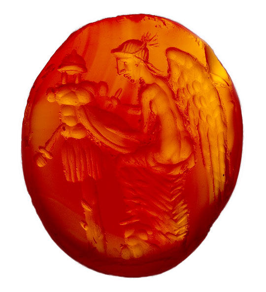 Amber coloured carved gemstone from a ring setting found at Lullingstone Roman Villa, depicting winged victory with armour and weapons