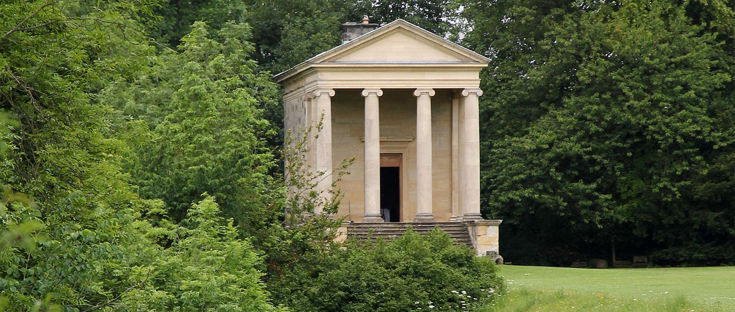 A small stone temple with columns at the front surrounded by green countryside (image courtesy of Alan  Carter/Alamy)