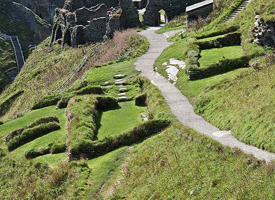 The remains on Tintagel island. To the left of the path are some of the remains of the 5th- to 7th-century settlement 