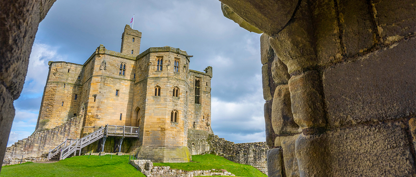 Image: Warkworth castle as seen through and archway