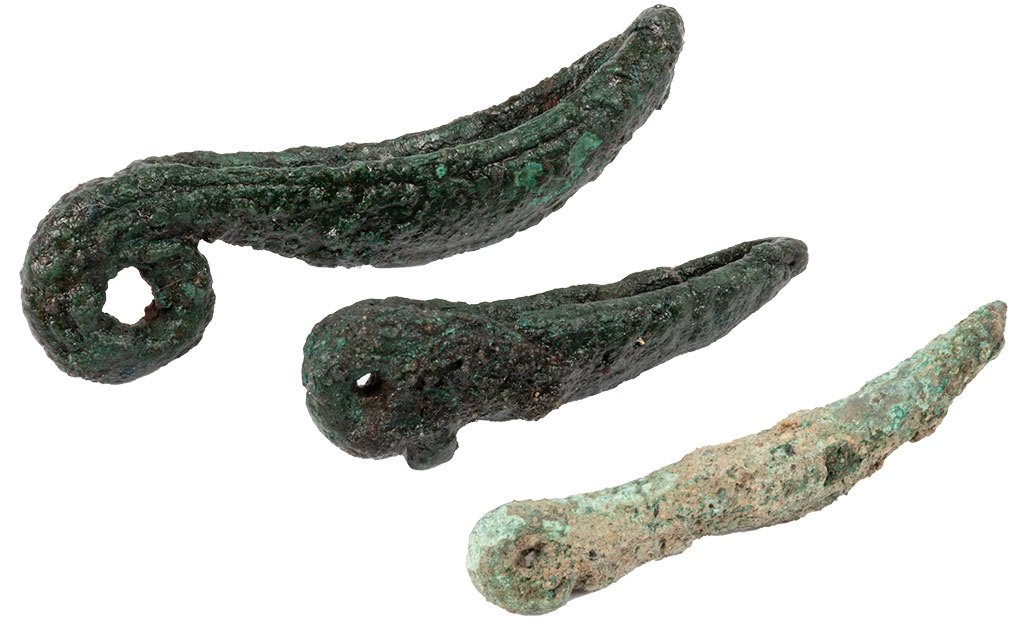 Two copper alloy cosmetic mortars and a pestle found at Wroxeter Roman City