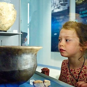 girl looking in exhibition case