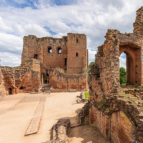 A view of the medieval ruins at Kenilworth Castle, including the walls of the Great Hall and the kitchens.