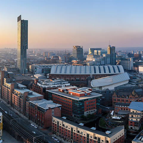 A view of the Manchester city scape at sunrise.