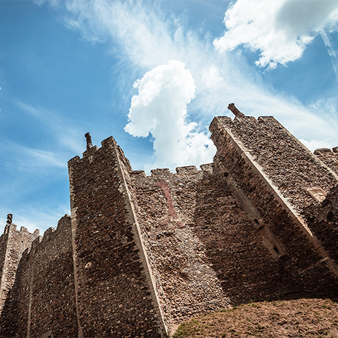 Looking up at tall castle walls