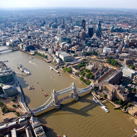 An aerial view of the River Thames, with view of Tower Bridge.