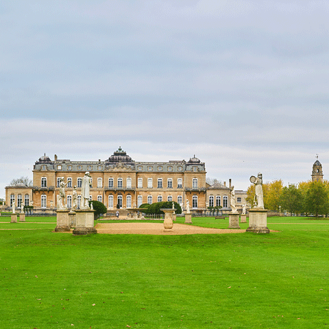The exterior or Wrest Park from the gardens on a clear day.