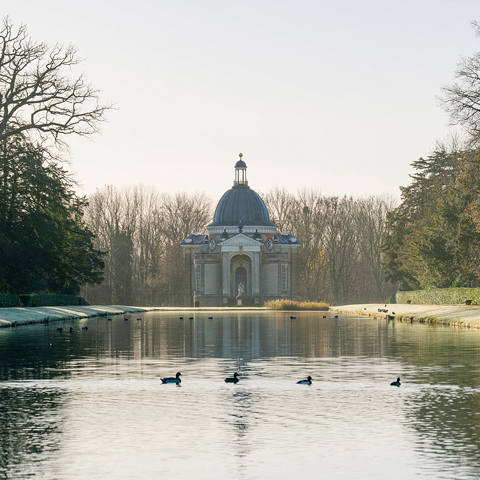 The pavilion at Wrest Park with the large pond and ducks in the foreground.