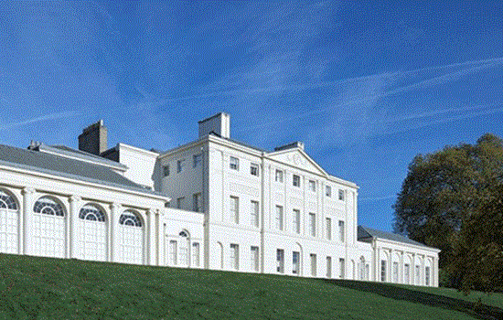 An exterior side on view of Kenwood House underneath a blue sky. An exterior side on view of Kenwood House underneath a blue sky.