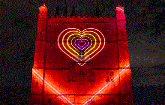 Bolsover Castle is lit up at night with large red projections with large glowing colourful hearts projected on the centre of the building.  Bolsover Castle is lit up at night with large red projections with large glowing colourful hearts projected on the centre of the building.