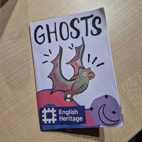 A handmade purple booklet, with the heading reading 'Ghosts.''