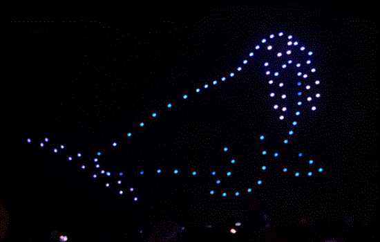 A colourful light drone display in the shape of a sea lion at night. A colourful light drone display in the shape of a sea lion at night.
