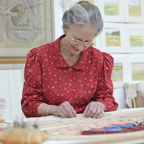 Image: Diana Springall embroidering 