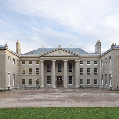 A view of the north entrance and portico at Kenwood on a cloudy day.