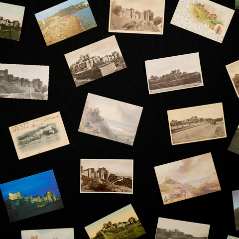 Historic photographs of Dover Castle laid out on a black background.