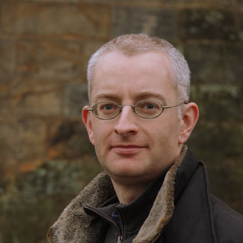A close-up image of author and historian Marc Morris.
